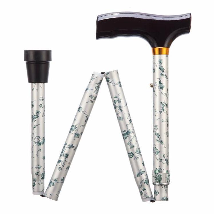 a white and black handle with a flower pattern on it