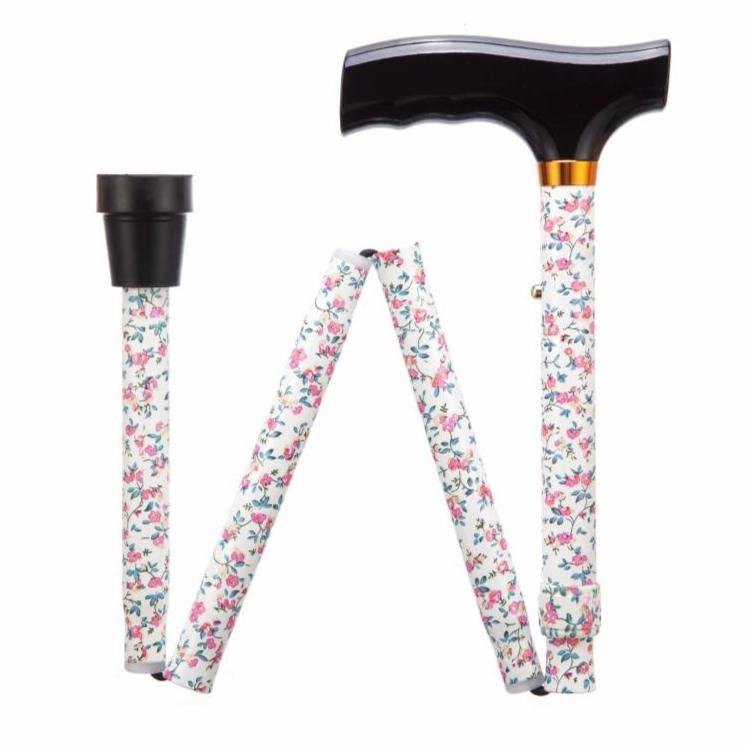 a white and pink flowered lanyard with a black handle